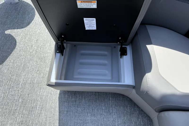 Slide: The Image of Open storage compartment in 2026 Premier 230 Sunsation Angler 2pt boat seat. - 28