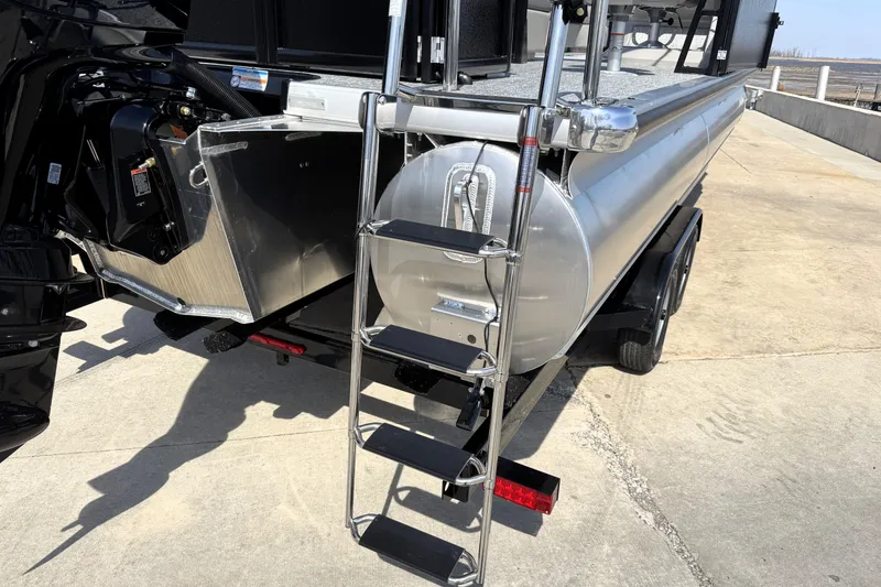 Slide: The Image of Rear view of 2026 Premier 230 Sunsation Angler 2pt boat with ladder and motor. - 29