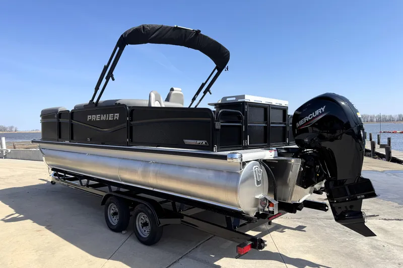 Slide: The Image of 2026 Premier 230 Sunsation Angler 2pt pontoon boat with Mercury engine at dockside. - 3