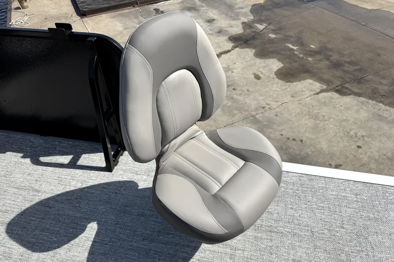 Slide: The Image of Premier 230 Sunsation Angler 2pt 2026 boat seat, gray upholstery, outdoor setting. - 32
