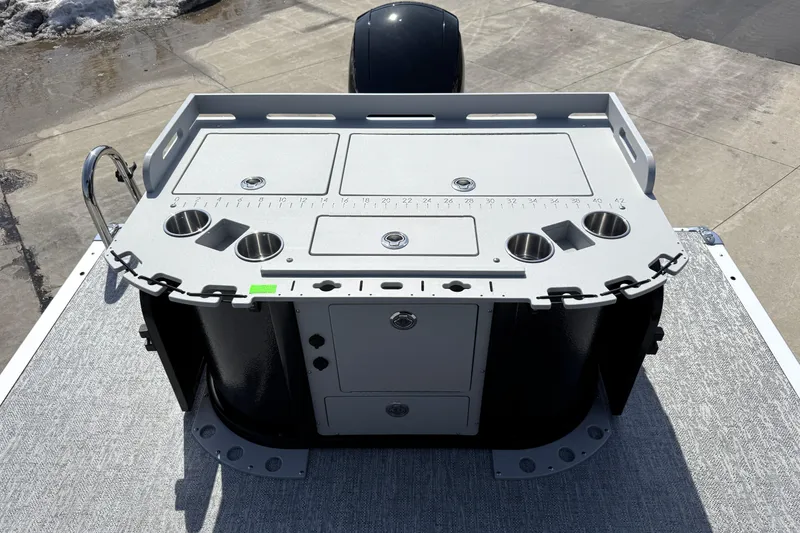 Slide: The Image of 2026 Premier 230 Sunsation Angler 2pt boat console with cup holders and storage compartments. - 33