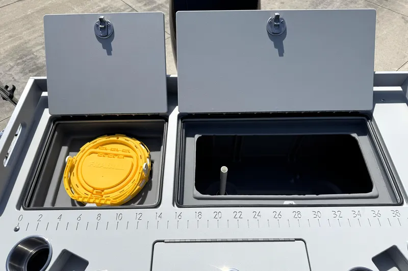 Slide: The Image of Premier 230 Sunsation Angler 2pt 2026 boat storage compartments with measuring scale. - 34