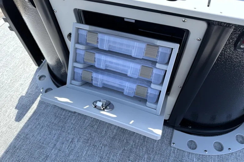 Slide: The Image of Storage compartment with tackle boxes on 2026 Premier 230 Sunsation Angler 2pt boat. - 37