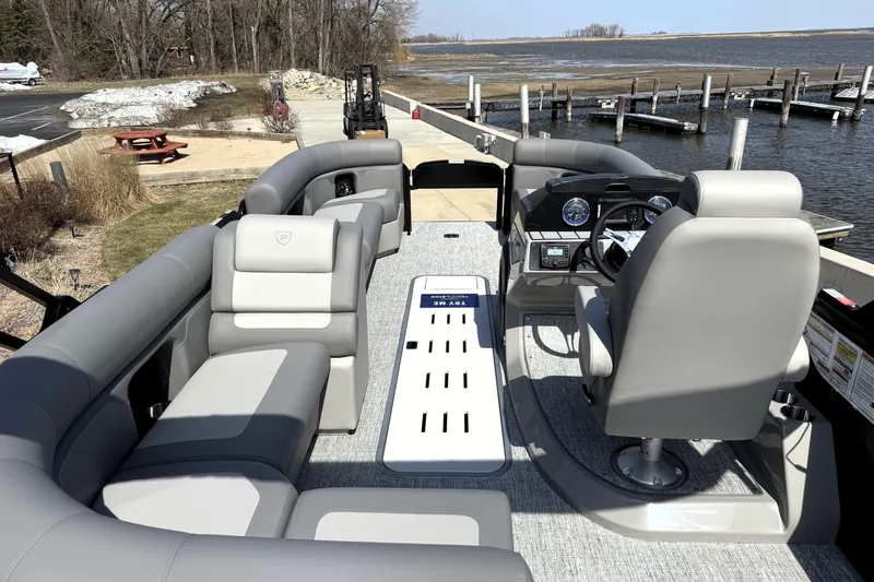 Slide: The Image of Premier 230 Sunsation Angler 2pt 2026 pontoon boat interior with seating and steering console. - 39