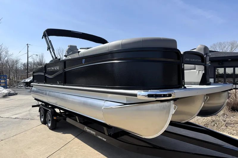 Slide: The Image of 2026 Premier 230 Sunsation Angler 2pt pontoon boat on trailer, sleek black design. - 7