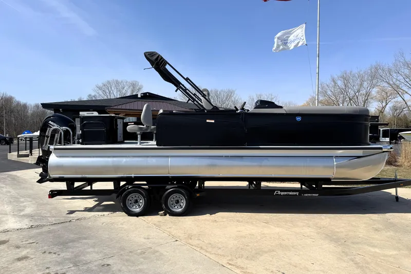 Slide: The Image of 2026 Premier 230 Sunsation Angler 2pt pontoon boat on trailer, outdoor setting. - 9