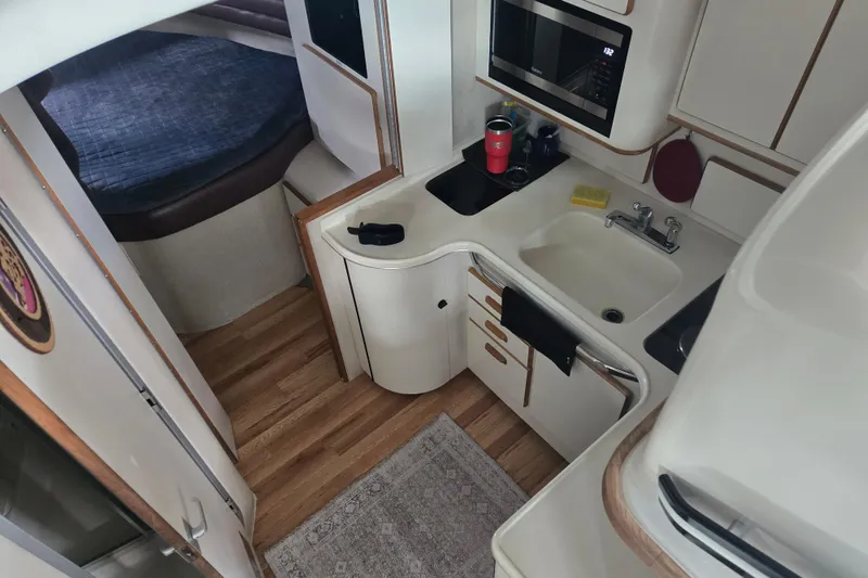 Slide: The Image of 1994 Sea Ray 370 Sedan Bridge dashboard with gauges and controls. - 11