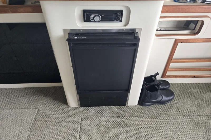 Slide: The Image of Interior of 1994 Sea Ray 370 Sedan Bridge with mirror and storage cabinet. - 18