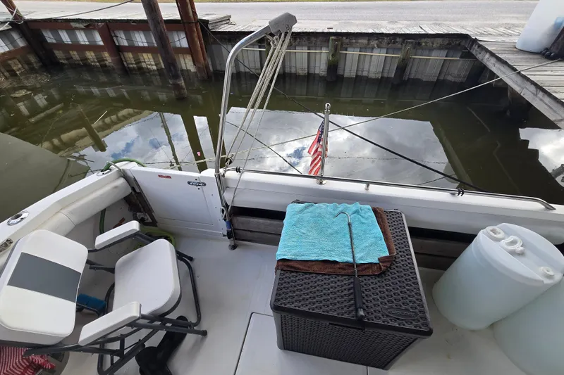 Slide: The Image of 1994 Sea Ray 370 Sedan Bridge cabin with cozy bed and porthole windows. - 19