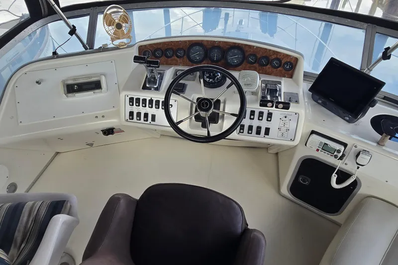 Slide: The Image of 1994 Sea Ray 370 Sedan Bridge bathroom with sink, mirror, and toilet. - 20