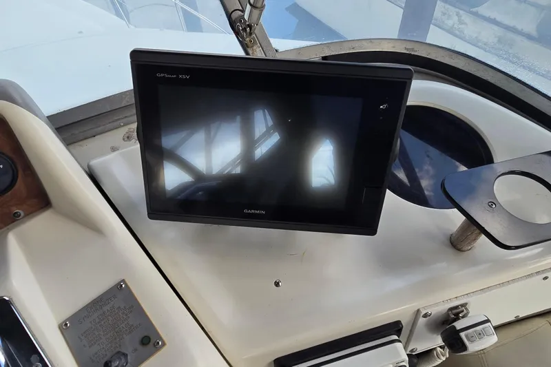 Slide: The Image of Interior view of 1994 Sea Ray 370 Sedan Bridge yacht with sliding door and seating area. - 21