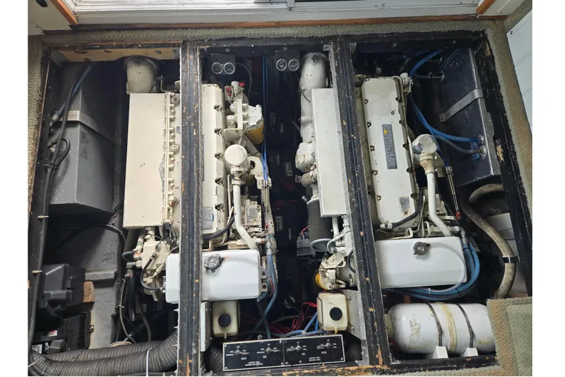 Slide: The Image of Engine compartment of a 1994 Sea Ray 370 Sedan Bridge boat, showcasing dual engines. - 5