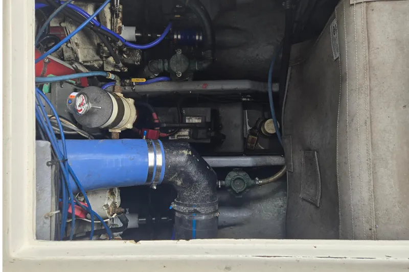 Slide: The Image of Engine compartment of a 1994 Sea Ray 370 Sedan Bridge with visible components and wiring. - 6