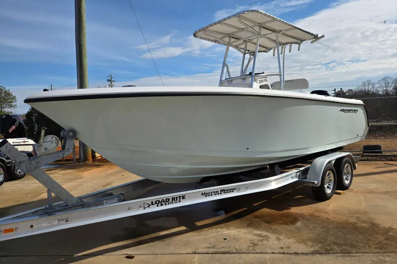 The Image of 2024 Aquasport 2200 Center Console boat on trailer, ready for adventure. - 0