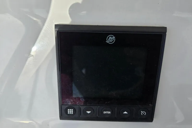 Slide: The Image of Control panel on 2024 Aquasport 2200 Center Console boat dashboard. - 14