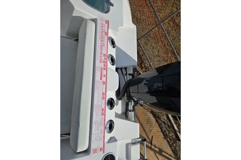 Slide: The Image of 2024 Aquasport 2200 Center Console boat with saltwater fish ruler and cup holders. - 17