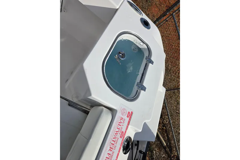 Slide: The Image of 2024 Aquasport 2200 Center Console boat with livewell and seating area. - 18