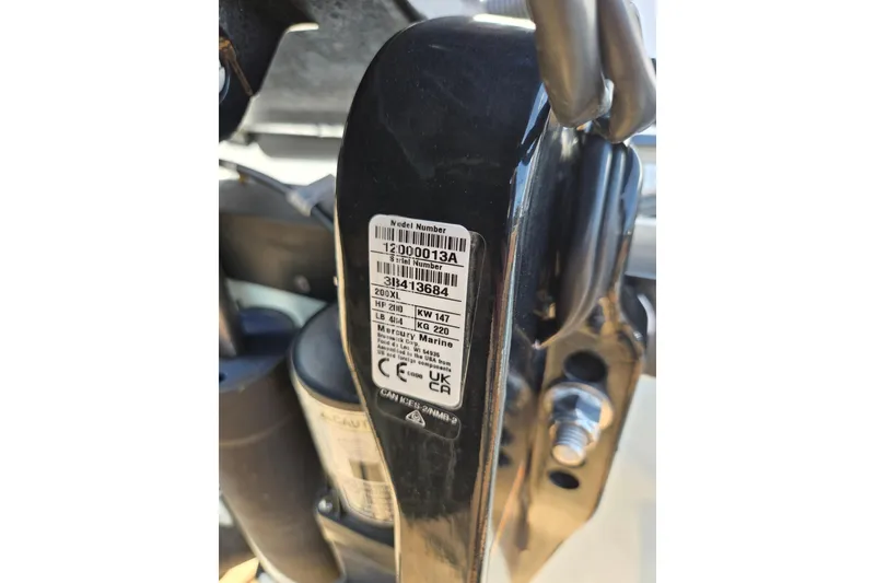 Slide: The Image of Label on 2024 Aquasport 2200 Center Console boat engine, showing model and serial numbers. - 20