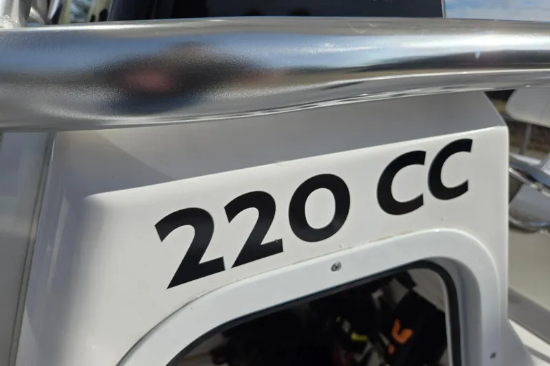 Slide: The Image of 2024 Aquasport 2200 Center Console boat detail with "220 CC" marking. - 21