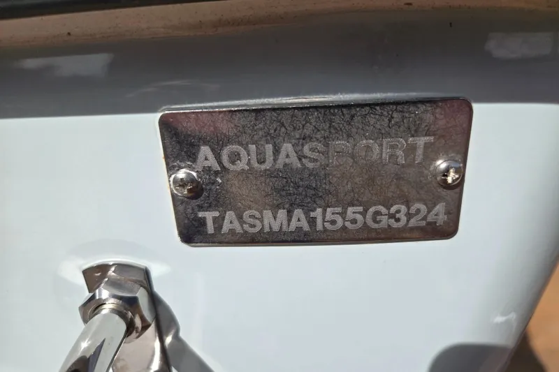 Slide: The Image of 2024 Aquasport 2200 Center Console boat identification plate with serial number. - 22
