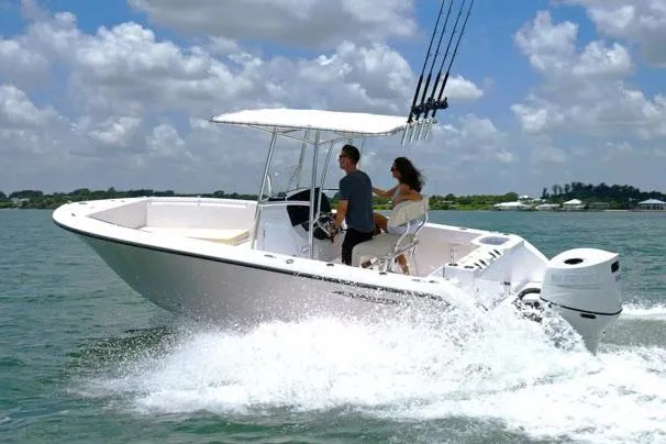 Slide: The Image of Manufacturer Provided Image: 2024 Aquasport 2200 Center Console boat cruising on a sunny day. - 28