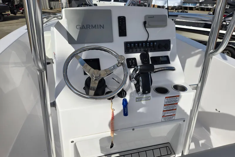 Slide: The Image of 2024 Aquasport 2200 Center Console boat dashboard with Garmin navigation system. - 7