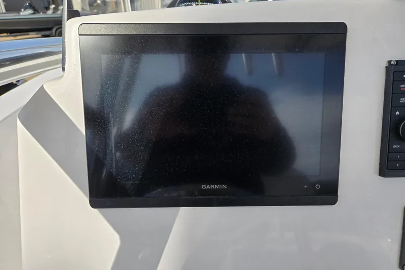 Slide: The Image of Garmin display on 2024 Aquasport 2200 Center Console boat dashboard. - 8