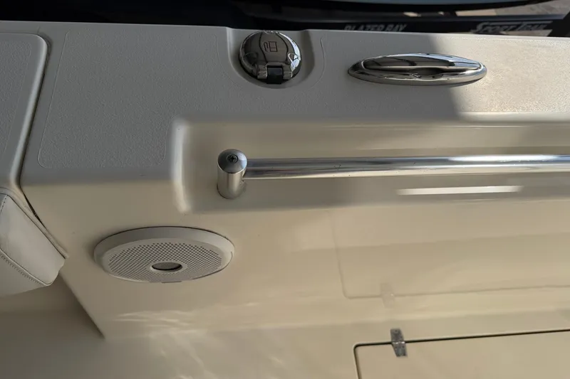 Slide: The Image of 2015 Cobia 344 Center Console boat interior with speaker and chrome fittings. - 102
