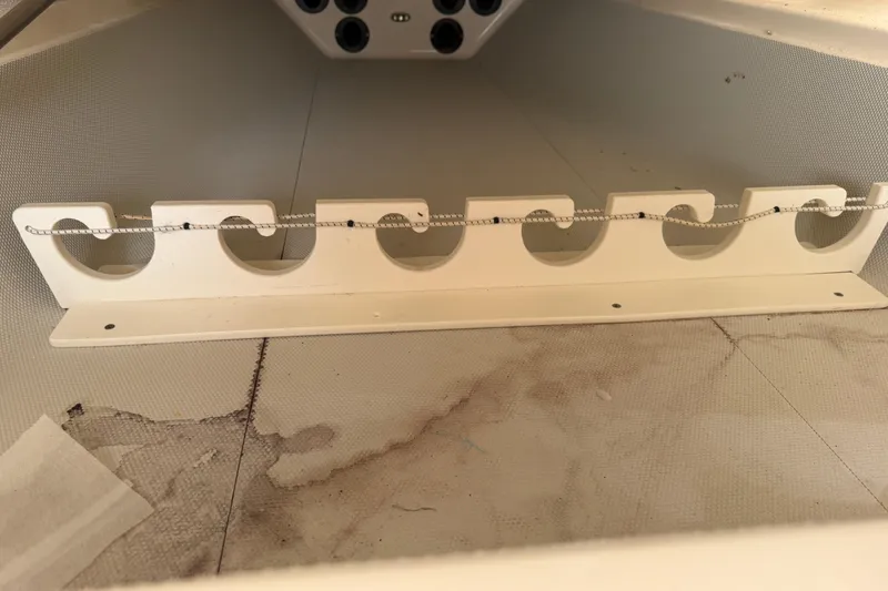 Slide: The Image of 2015 Cobia 344 Center Console rod holder with secure bungee cord. - 108