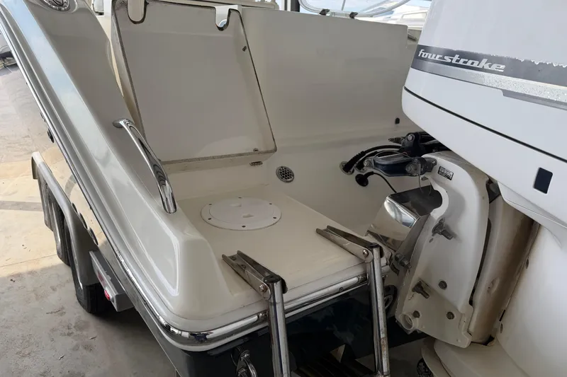 Slide: The Image of 2015 Cobia 344 Center Console boat with four-stroke engine, rear view. - 12