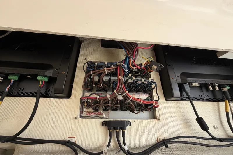 Slide: The Image of Electrical wiring and equipment inside a 2015 Cobia 344 Center Console boat. - 126