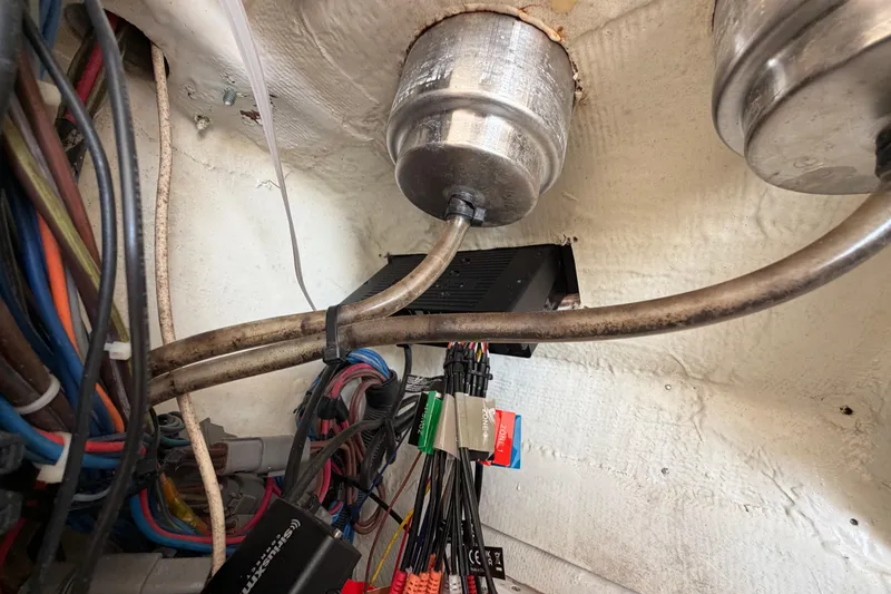 Slide: The Image of 2015 Cobia 344 Center Console wiring and components in engine compartment. - 128