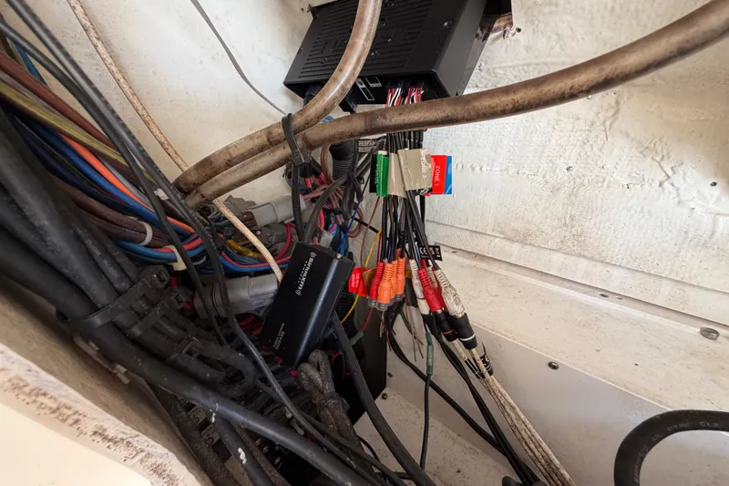 Slide: The Image of Wiring and electronics inside a 2015 Cobia 344 Center Console boat. - 129