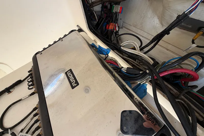 Slide: The Image of Electrical wiring and Fusion amplifier in 2015 Cobia 344 Center Console boat. - 134