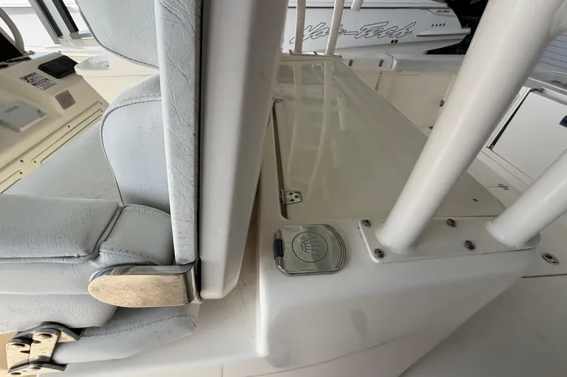 Slide: The Image of 2015 Cobia 344 Center Console boat interior with seating and console details. - 144