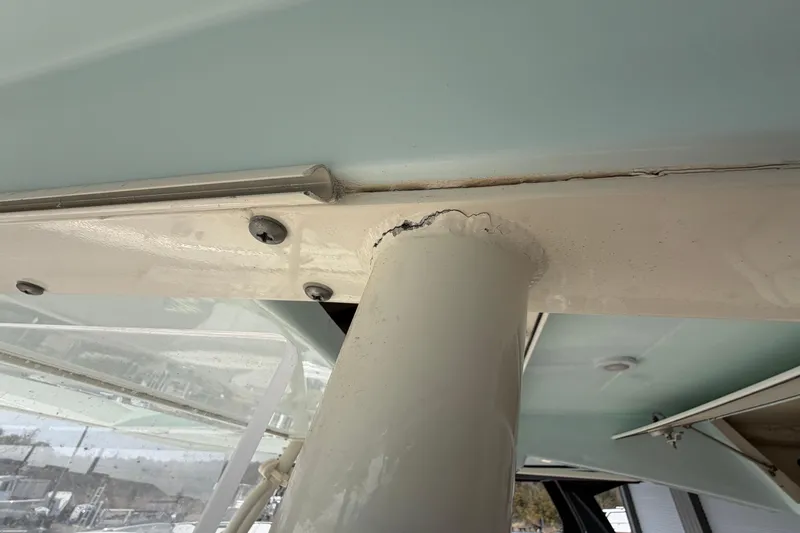 Slide: The Image of 2015 Cobia 344 Center Console boat showing structural detail and wear. - 146