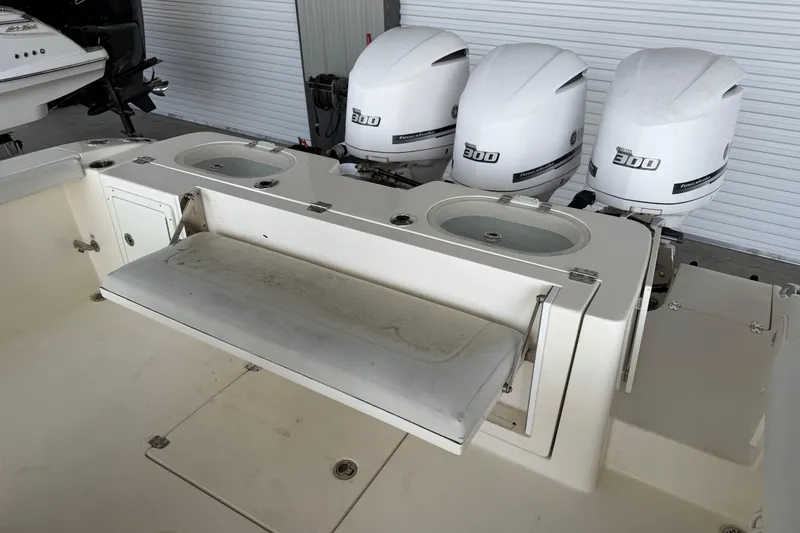 Slide: The Image of 2015 Cobia 344 Center Console boat with triple 300 horsepower engines. - 147