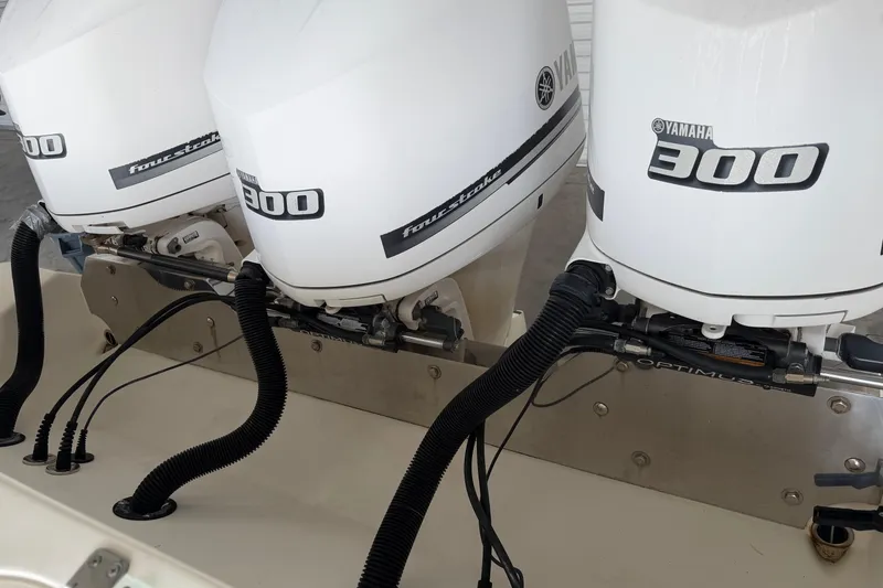 Slide: The Image of Triple Yamaha 300 outboard engines on a 2015 Cobia 344 Center Console boat. - 155