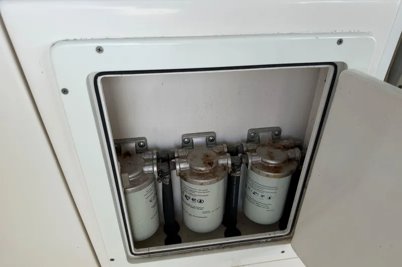 Slide: The Image of Fuel filters in a 2015 Cobia 344 Center Console boat compartment. - 21