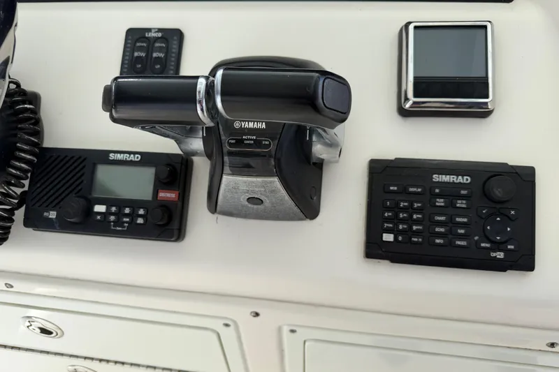 Slide: The Image of 2015 Cobia 344 Center Console dashboard with Yamaha controls and Simrad electronics. - 43