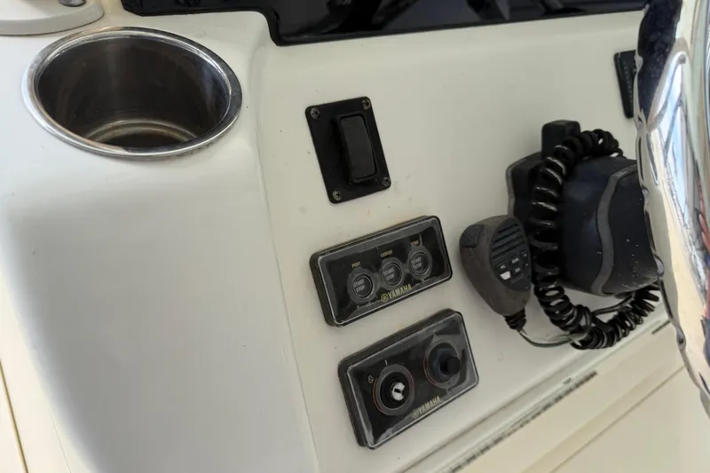 Slide: The Image of 2015 Cobia 344 Center Console dashboard with controls and communication equipment. - 47