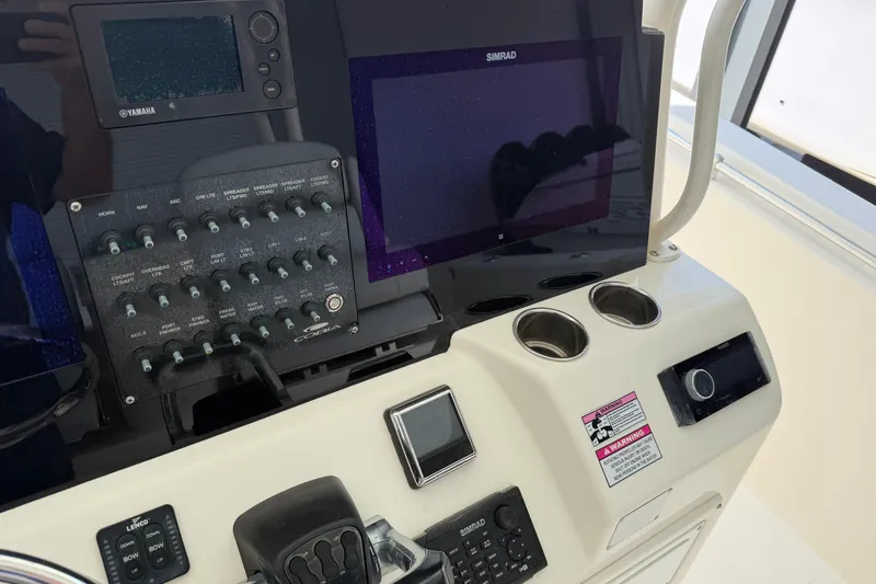 Slide: The Image of 2015 Cobia 344 Center Console dashboard with Yamaha and Simrad electronics. - 48