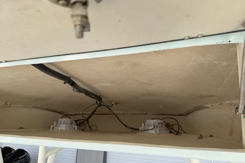 Slide: The Image of 2015 Cobia 344 Center Console wiring and components under the deck. - 51