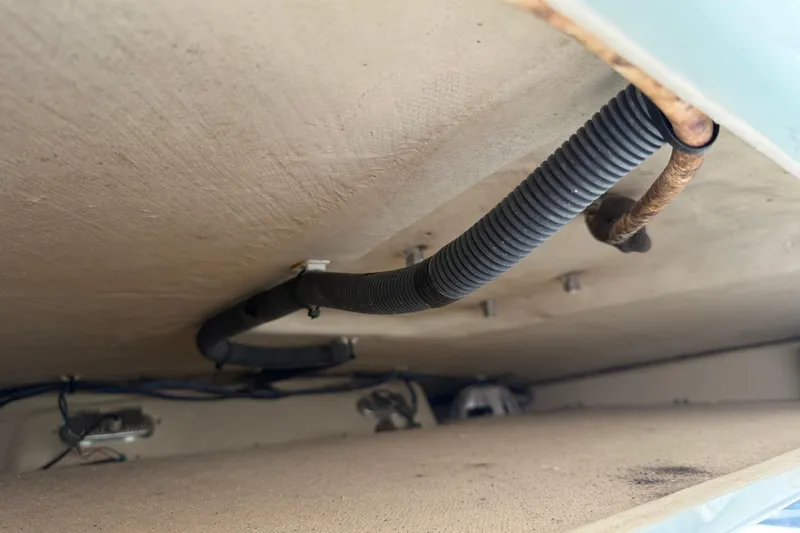 Slide: The Image of 2015 Cobia 344 Center Console interior wiring and tubing detail. - 52