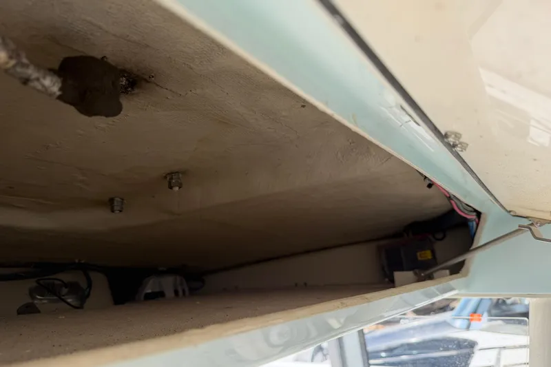 Slide: The Image of 2015 Cobia 344 Center Console interior view, showcasing wiring and structural details. - 53