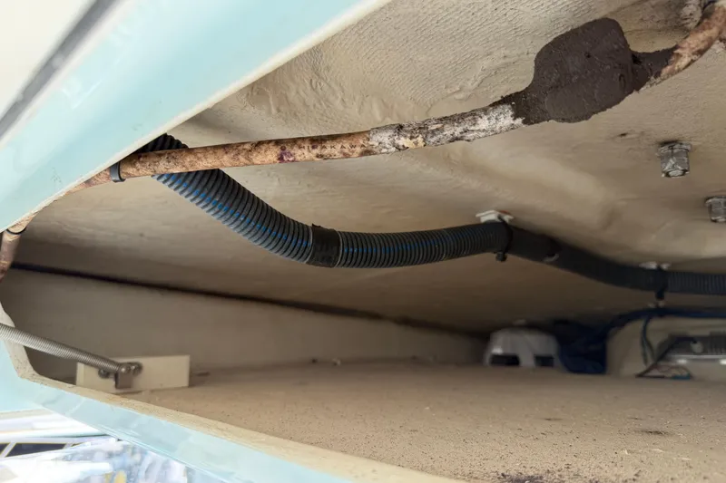 Slide: The Image of 2015 Cobia 344 Center Console boat interior wiring and plumbing details. - 55