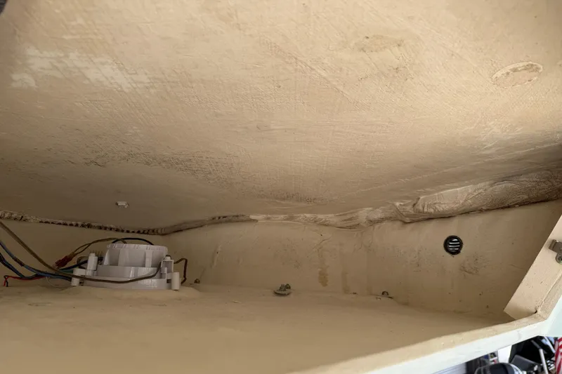 Slide: The Image of 2015 Cobia 344 Center Console interior wiring and components view. - 56