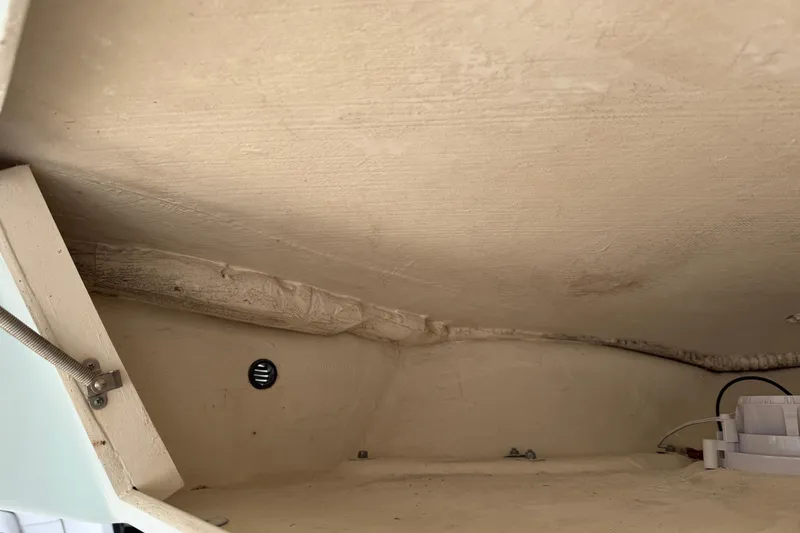 Slide: The Image of Interior view of a 2015 Cobia 344 Center Console boat compartment. - 57