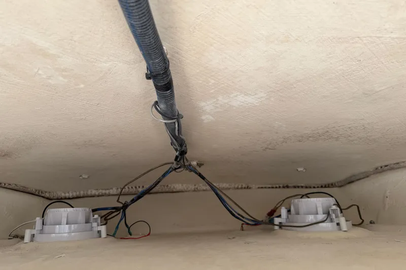 Slide: The Image of 2015 Cobia 344 Center Console wiring and components under deck. - 58