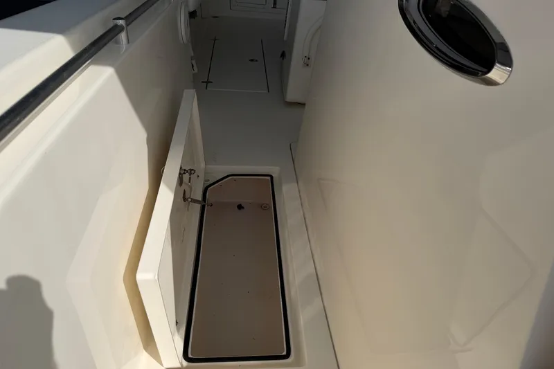 Slide: The Image of 2015 Cobia 344 Center Console boat interior storage compartment. - 59